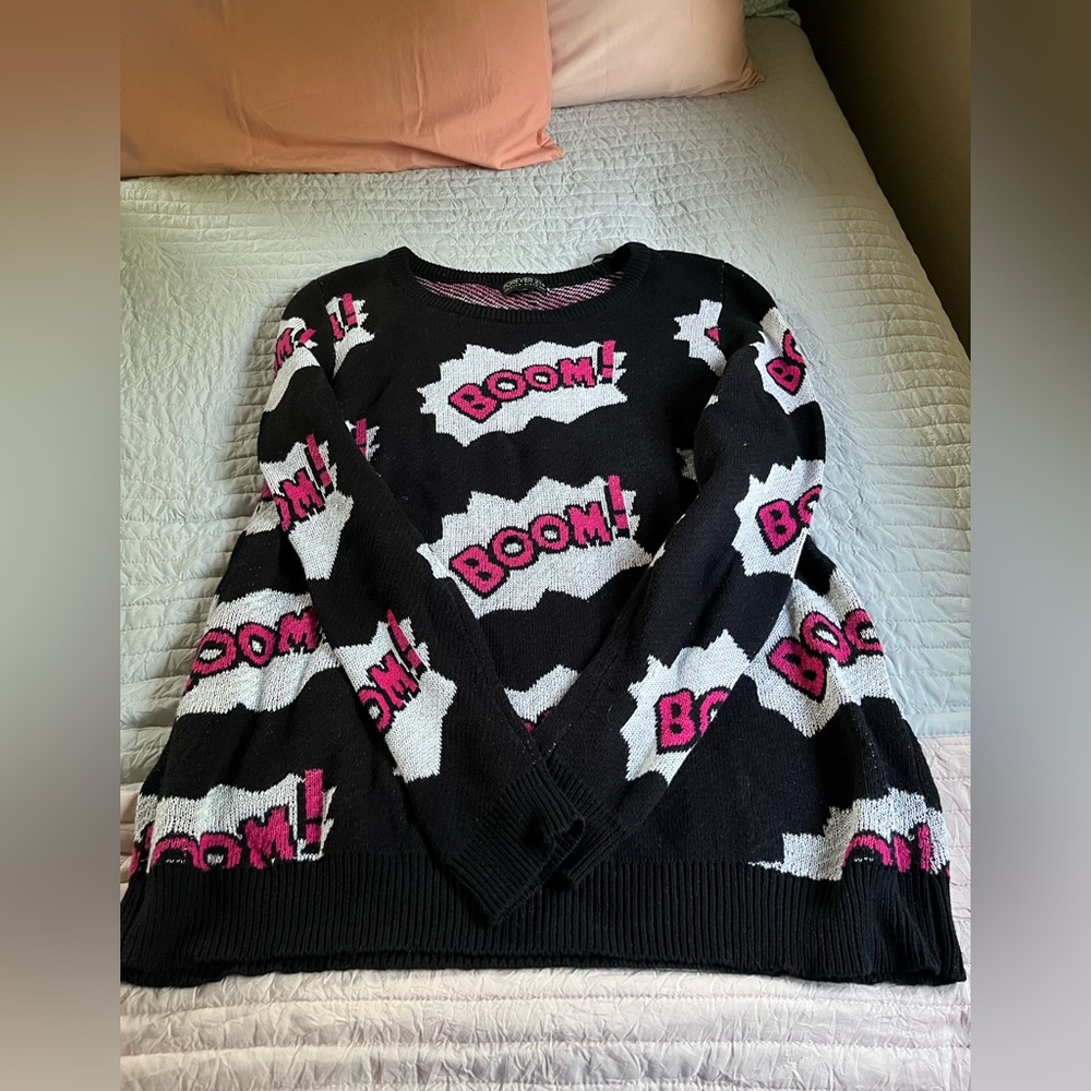 Mid-weight sweater, black and is fairly long.